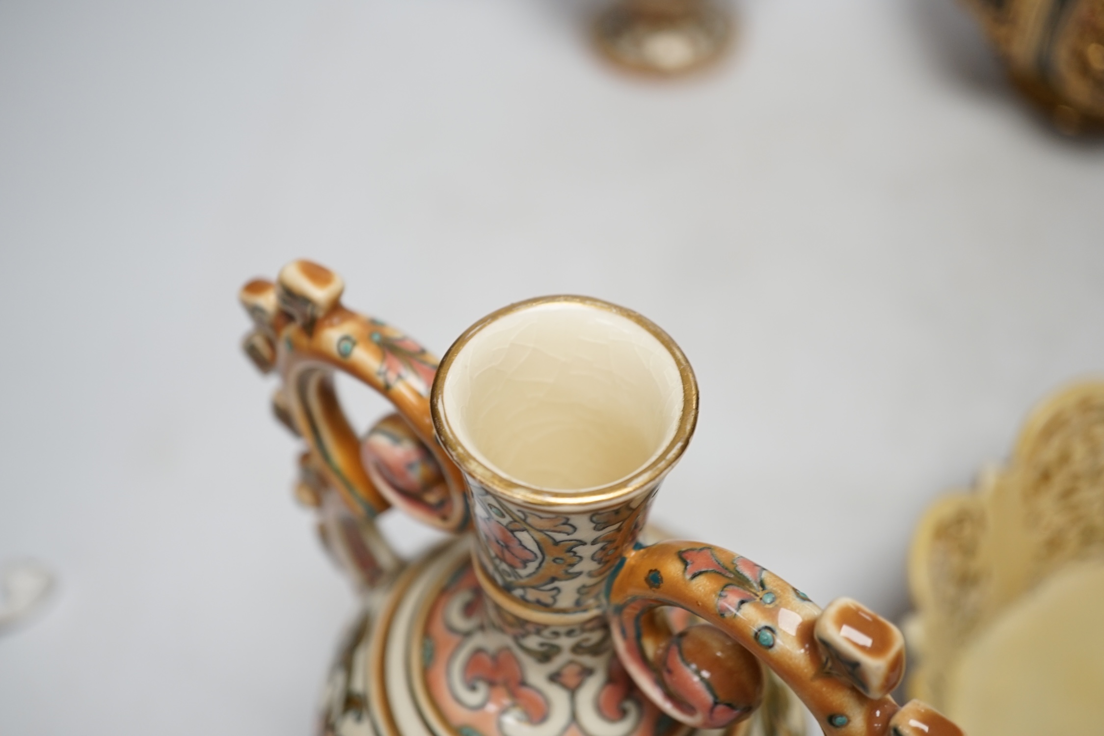 Hungarian pottery comprising pair of Zsolnay vases and covers, a pierced vase and a dish, 30cm high
